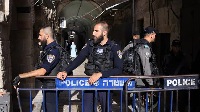 Israeli security forces cordon off the area surrounding the scene of the attack