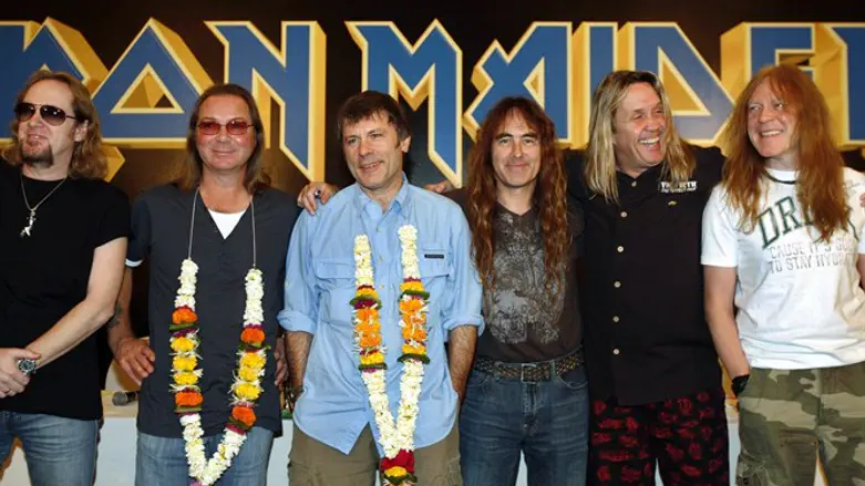 Iron Maiden band members pose for a photo in Mumbai