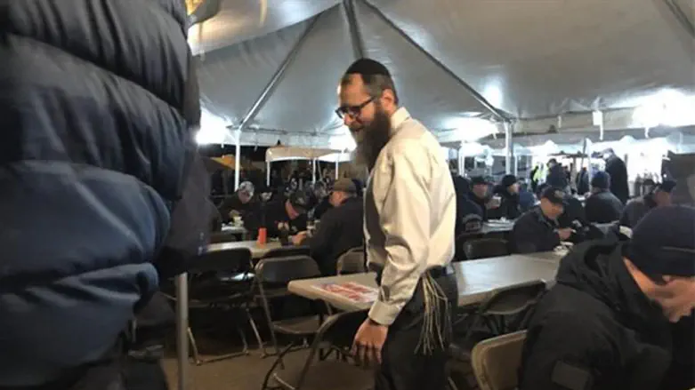 Rabbi Mendel Wolvovsky visits with firefighters