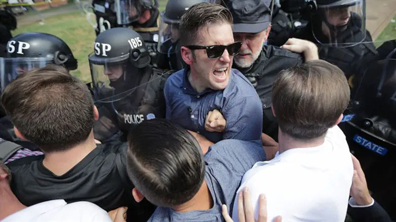 Richard Spencer, center, and supporters clash with police