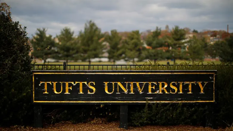 A sign stands at the edge of the campus of Tufts University in Medford