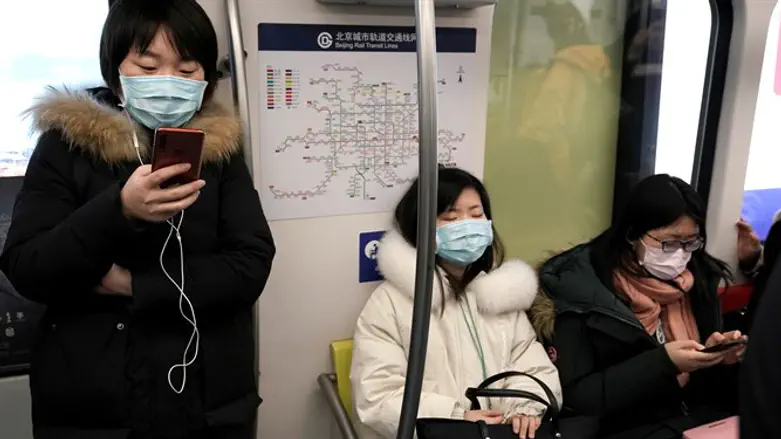 In China, citizens wear masks while riding a subway, to protect from a new coronavirus