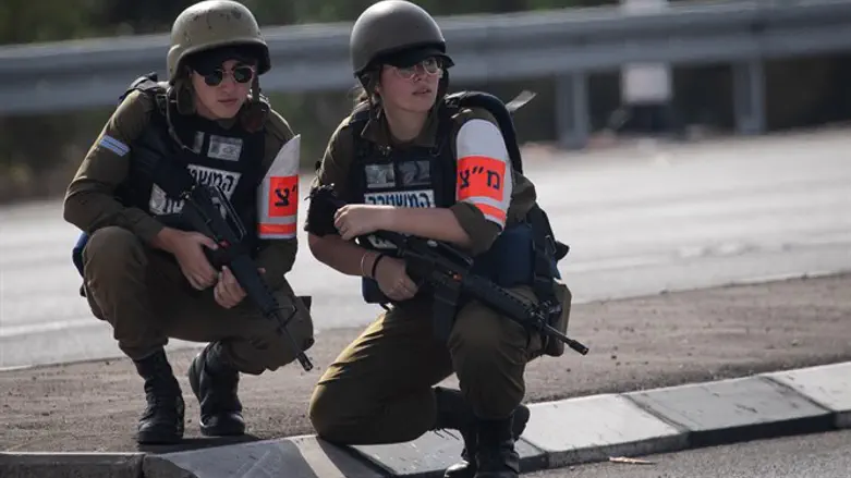 Israeli Military Police crouch for cover during Red Alert siren