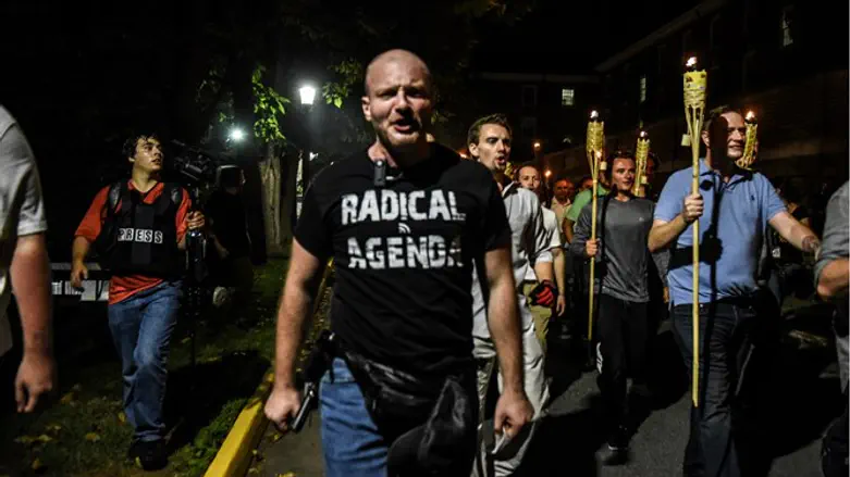 Christopher Cantwell marches with far-right demonstrators in Charlottesville