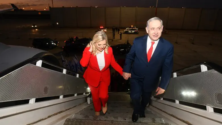 PM Netanyahu and his wife Sara board a plane to Uganda