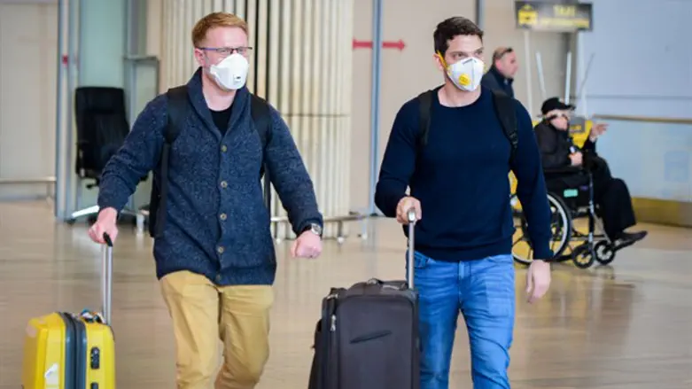 People wearing face masks for fear of the coronavirus at Ben Gurion Airport