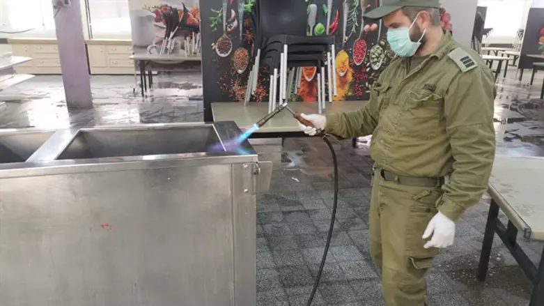 IDF soldier preparing base kitchen for Passover