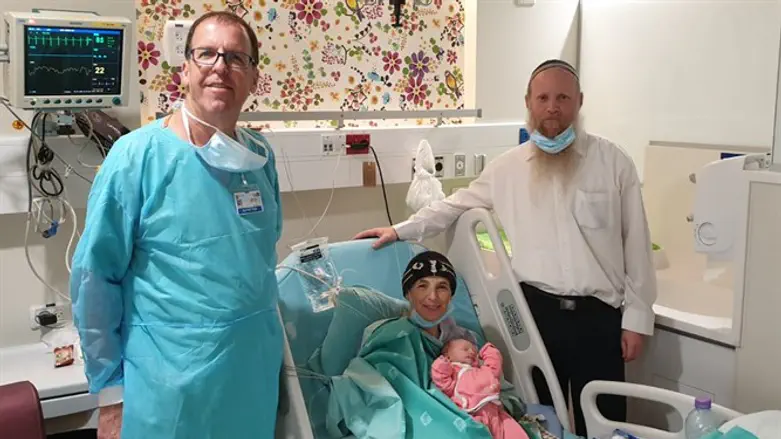 Dr. Moshe Batzar with Rabbi Eitan and Shira Shnerb and their new baby
