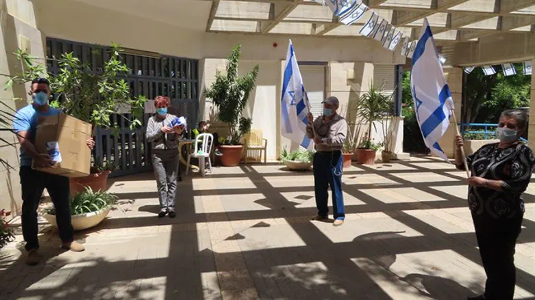 Distributing flags at a Ramat Hasharon nursing home