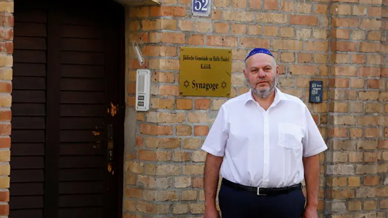 Head of Halle's Jewish community, stands in front of the synagogue