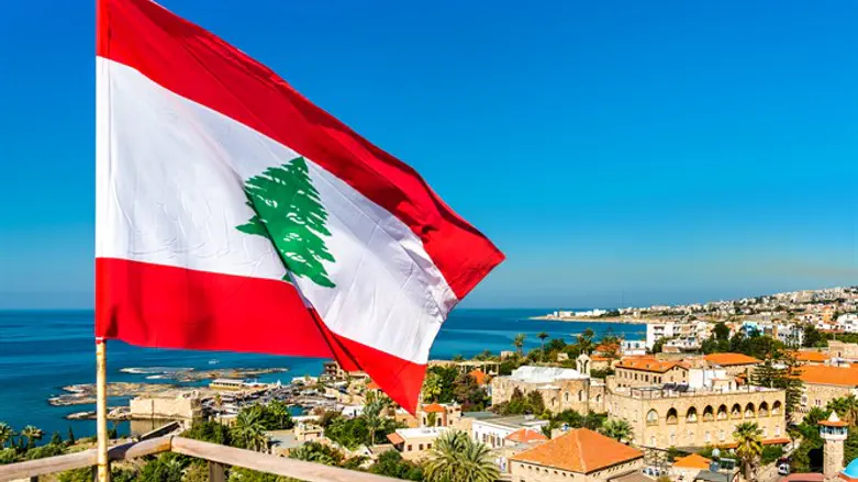 Lebanese flag with coastline in background