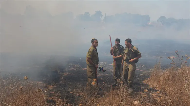 soldiers fight fire caused by Gaza arson terror