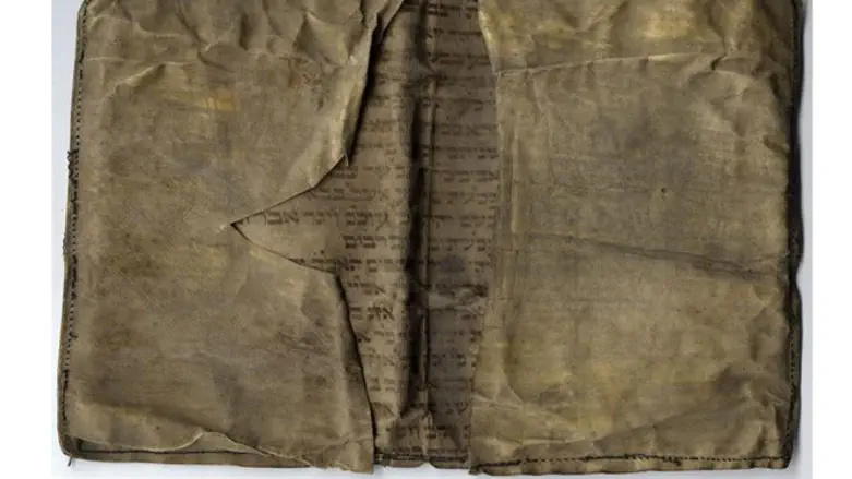 Wallet sewn from Torah scroll