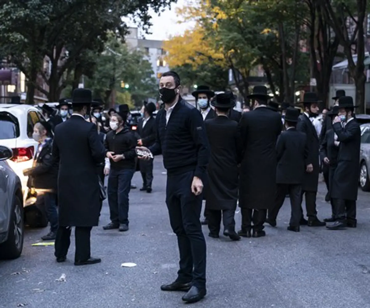 People congregate outside of Congregation Yetev Lev D'Satmar in Brooklyn