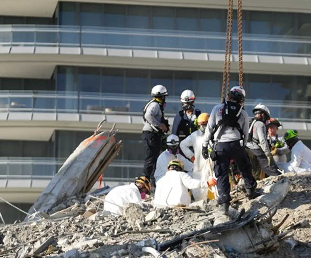 Search and rescue personnel work at the site of Surfside collapse