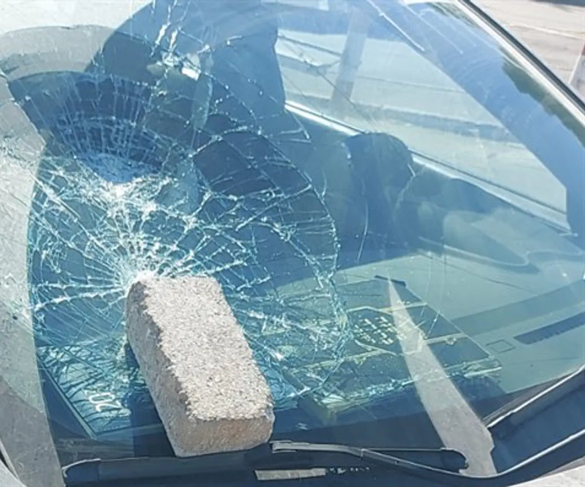 A rock thrown at the windshield