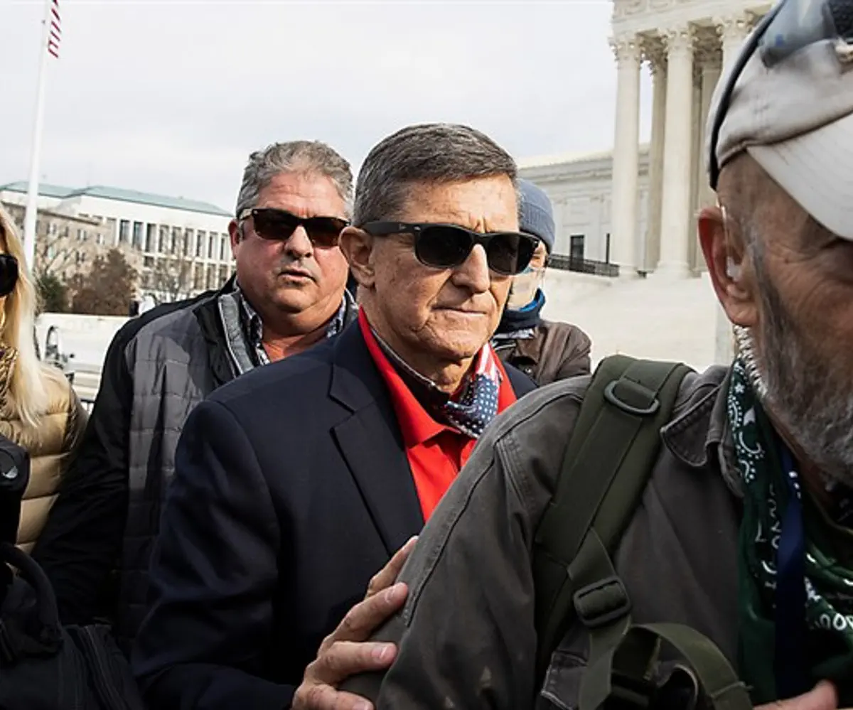 Former General Michael Flynn departs a protest of the outcome