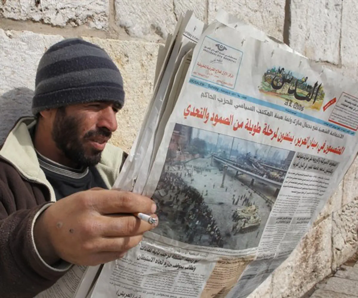 Arab reading newspaper, Old City, Jerusalem