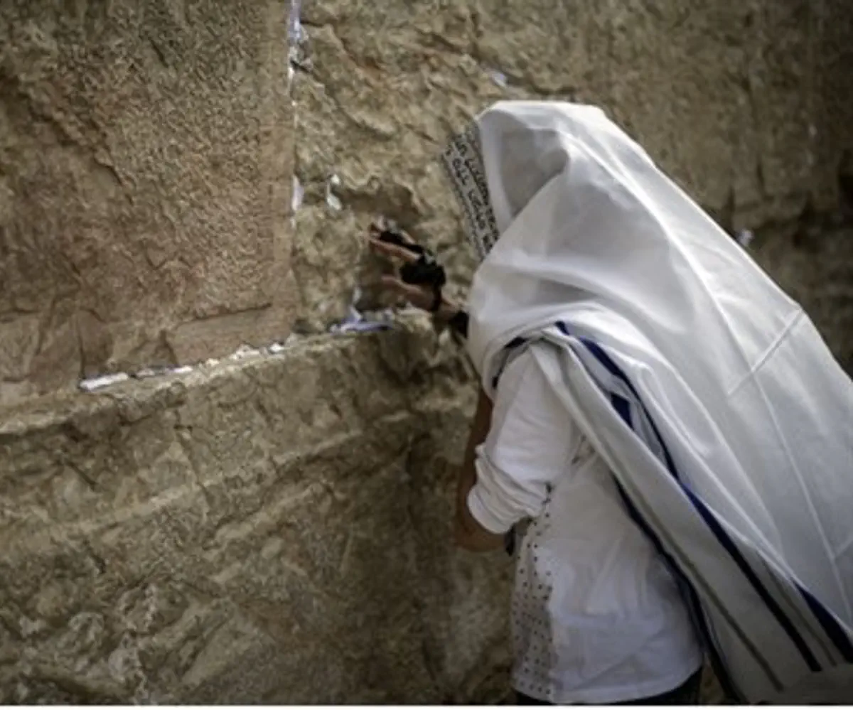 Man prays at the Kotel (Western Wall)