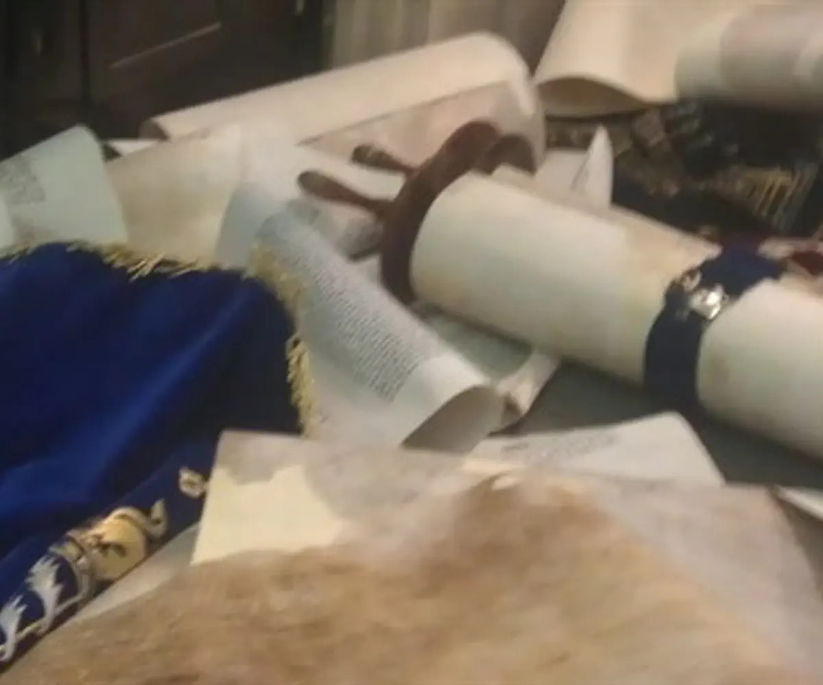 Torah scrolls thrown on the floor in Hemed