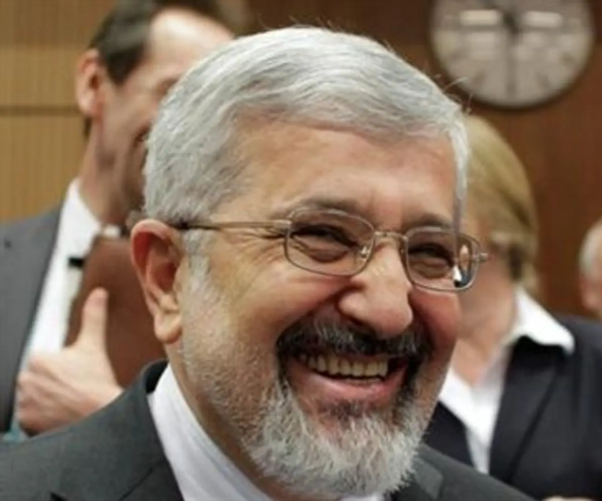 Iran's IAEA envoy Ali Asghar Soltanieh smiles