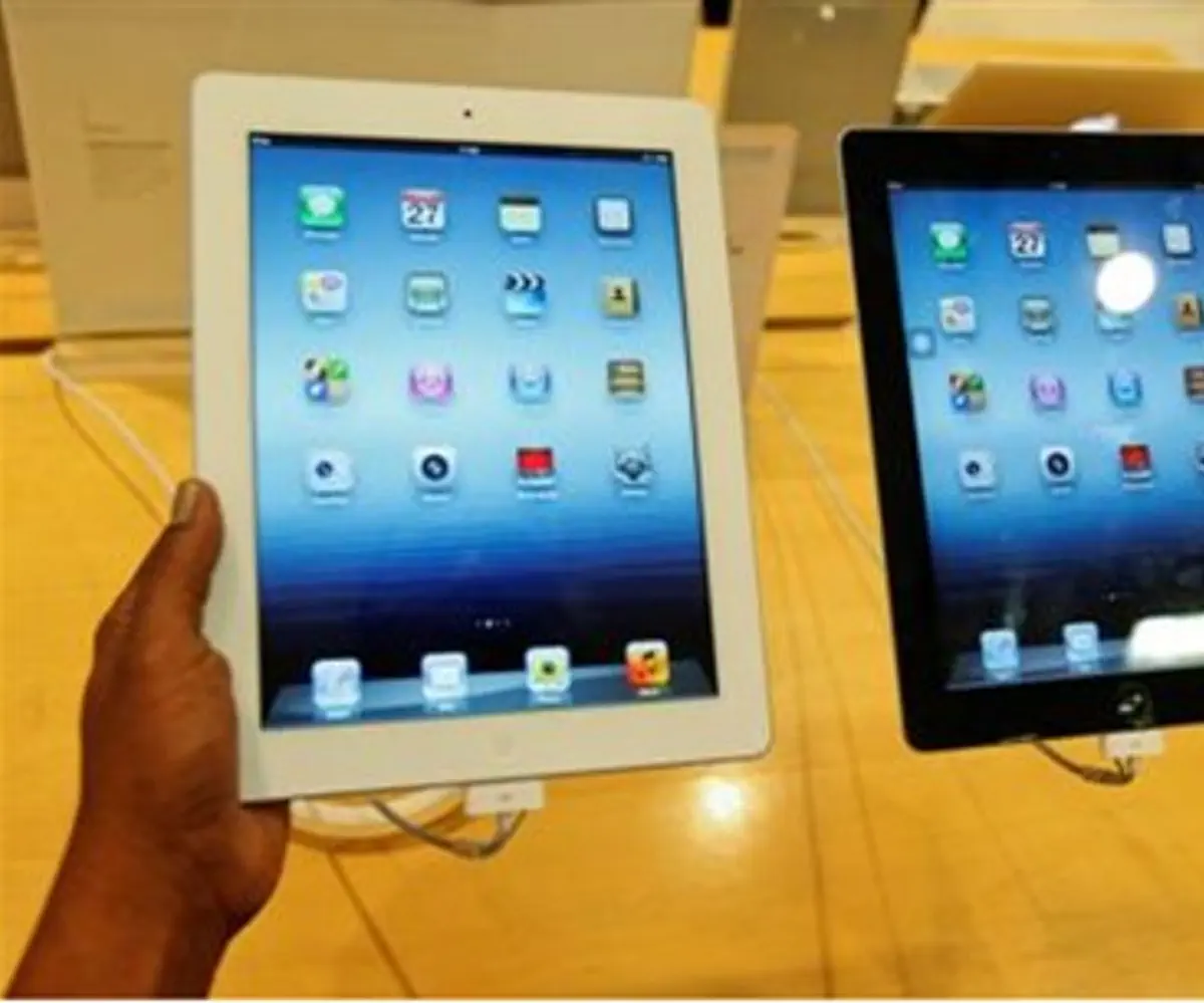 A man inspects the Apple New iPad 