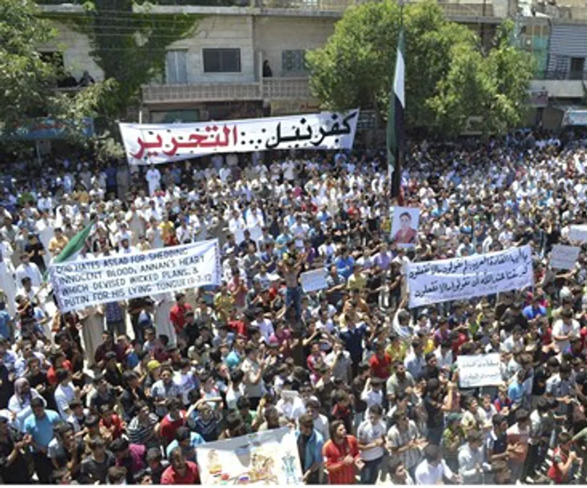 Demonstrators protest against Syria's Preside