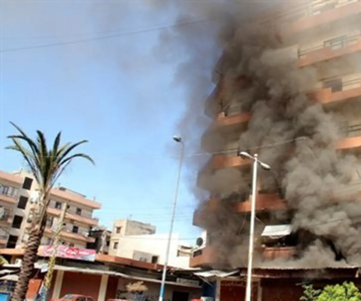  Smoke rises from Sunni Muslim dominant neigh