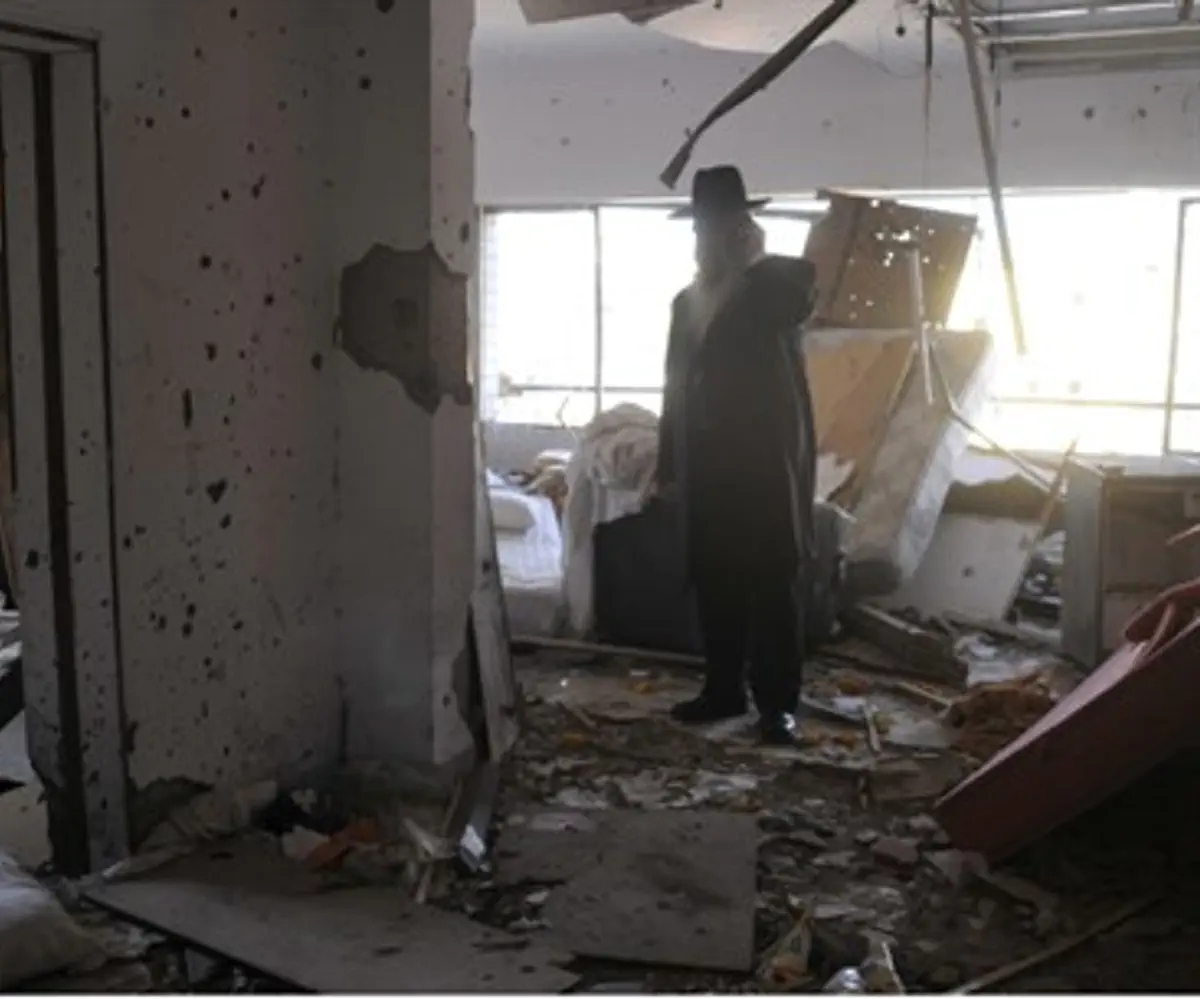 A Jewish man surveys the scene at Mumbai's Chabad house, after 2008 attack
