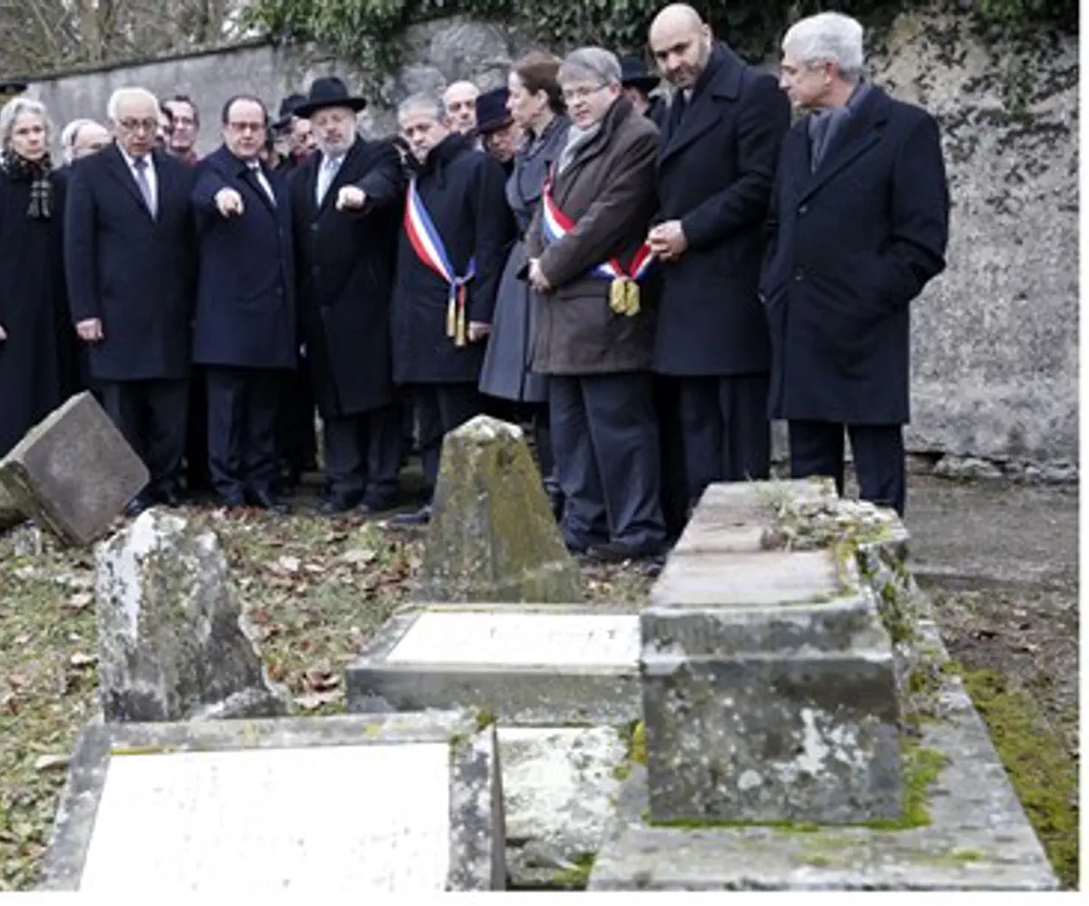 French President Francois Hollande views desecrated Jewish graveyard along with Jewish lea