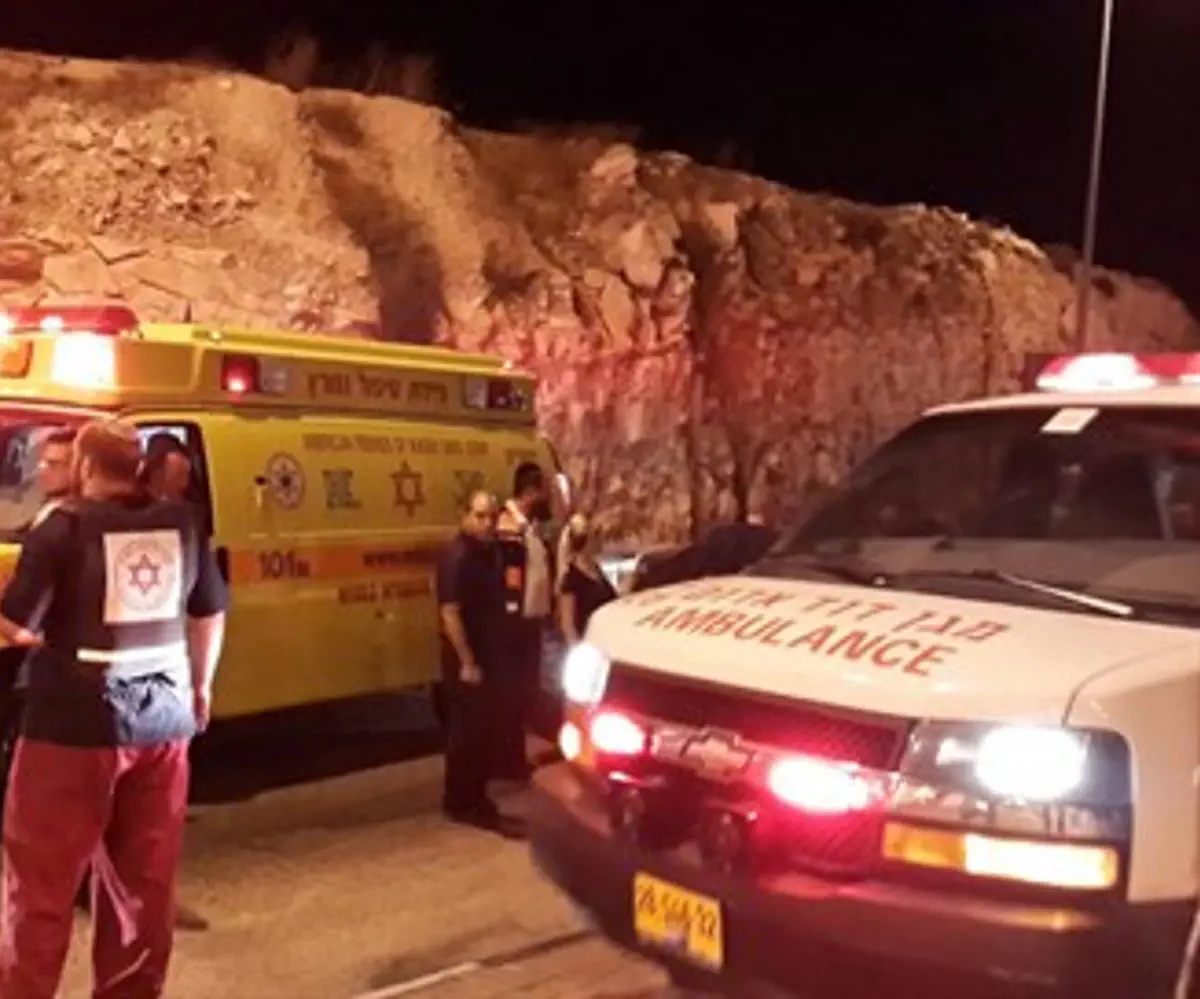 Paramedics and soldiers at the site of the attack