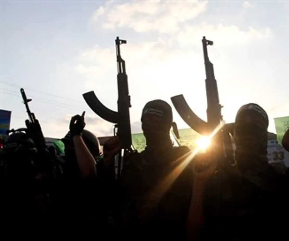 Hamas terrorists with Kalashnikov guns (illustration)