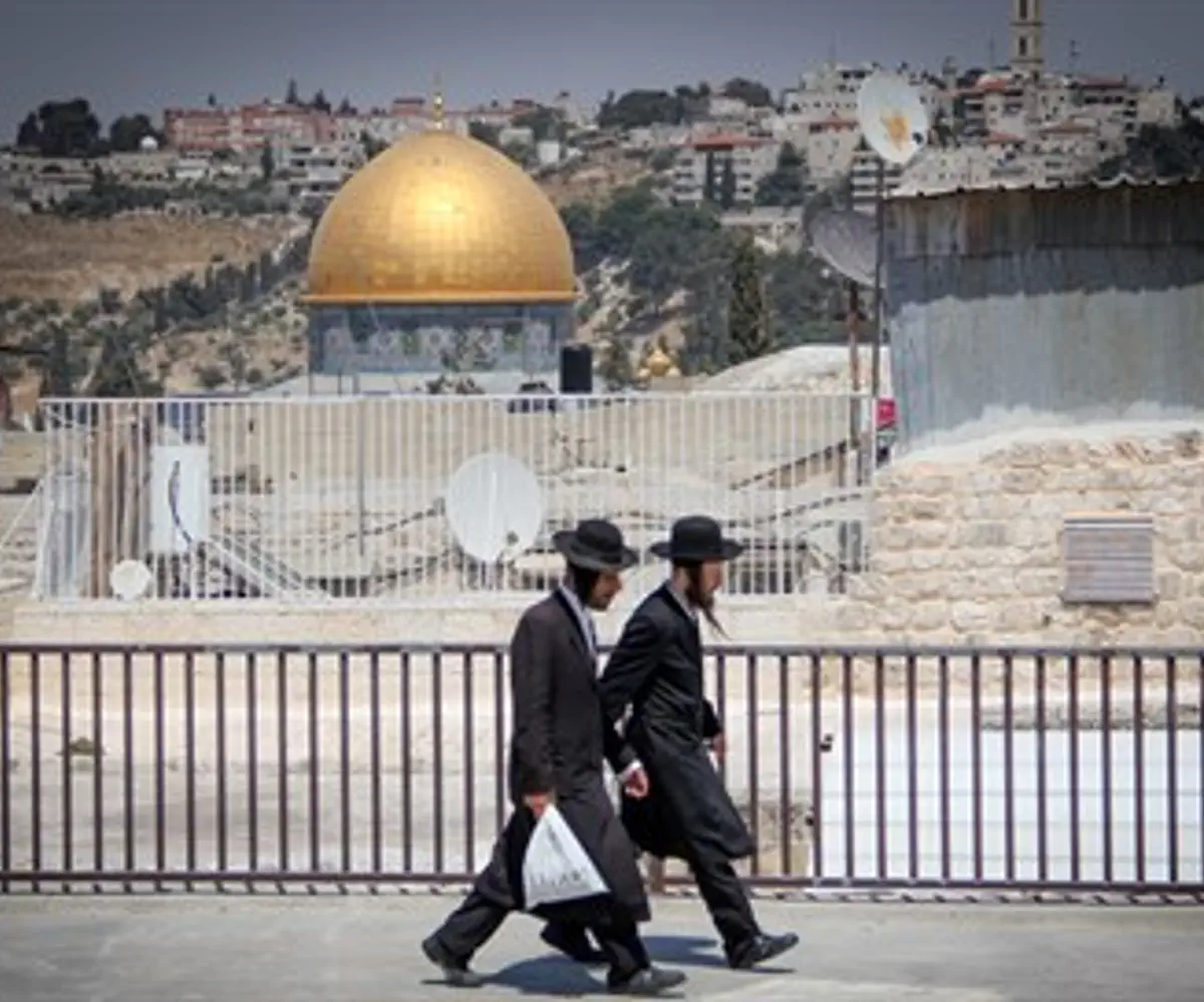 Haredi Jews walk close to the Temple Mount in Jerusalem