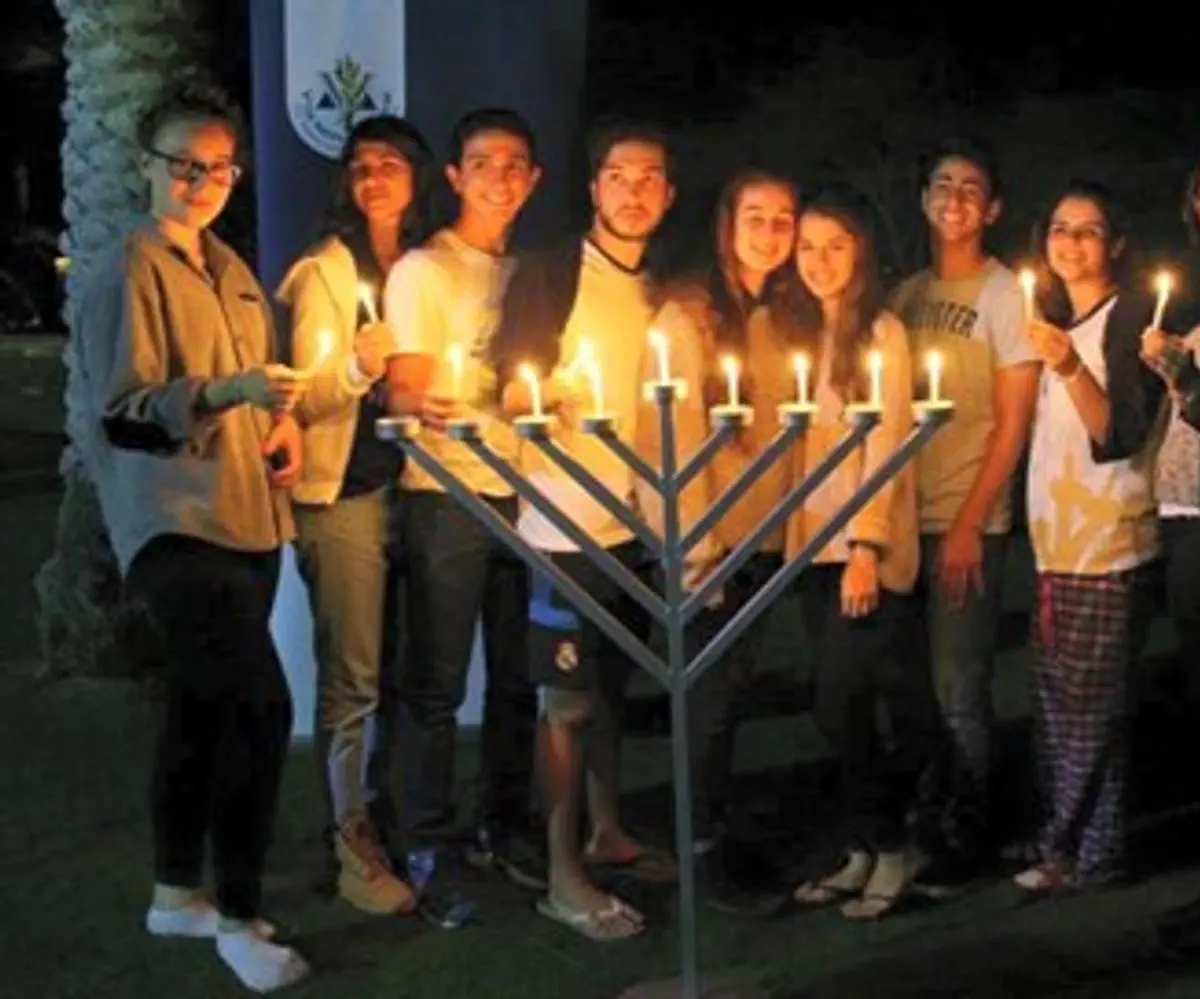 IDF orphans light Hanukkah candles