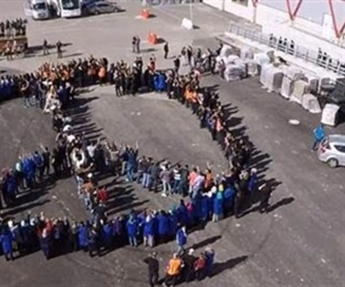 'SodaStream' factory workers form peace sign