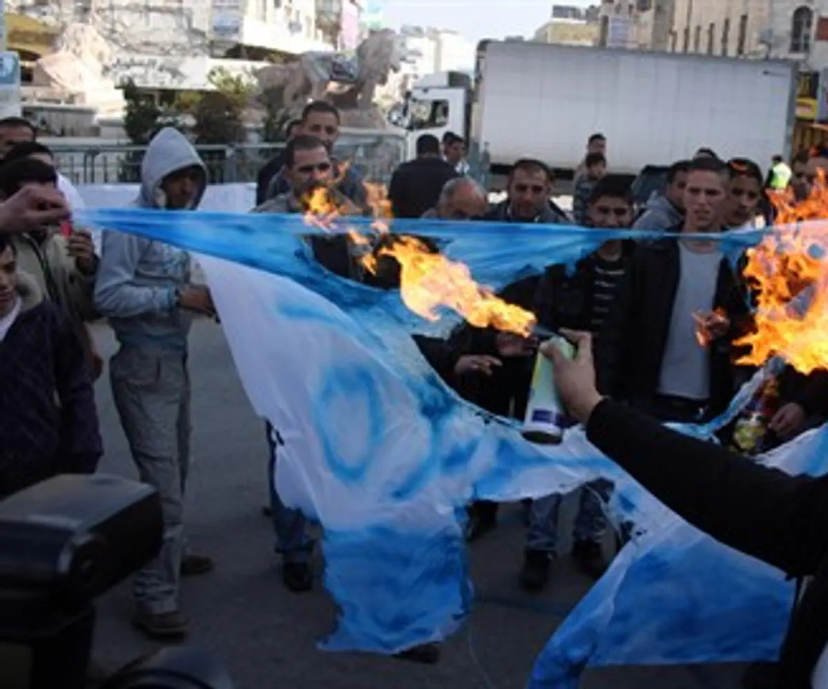 Burning Israeli flag in Ramallah