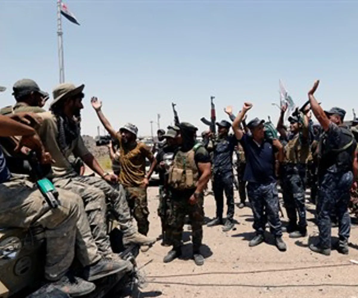 Anti-ISIS forces celebrate in Iraq after taking jihadist position