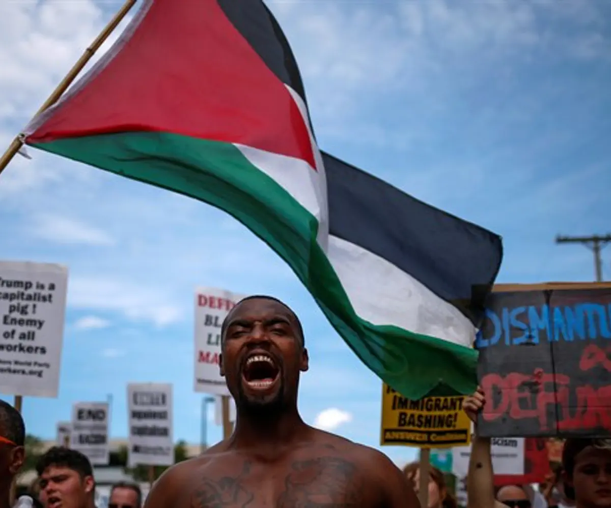 Black Lives Matter protest with Palestinian flag