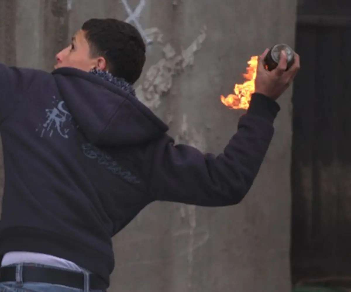 Arab youth throws firebomb
