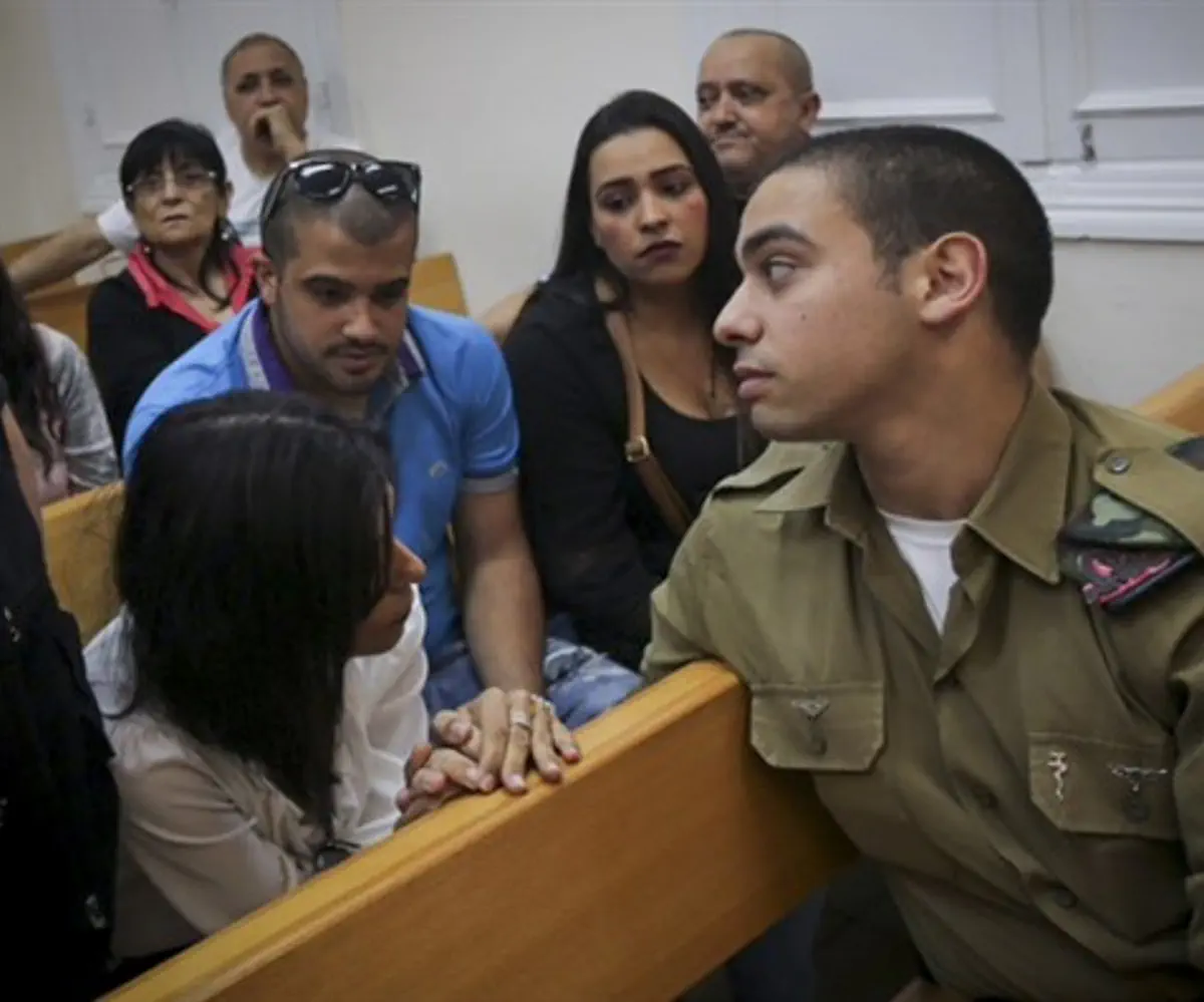 Elor Azariya in court with his family