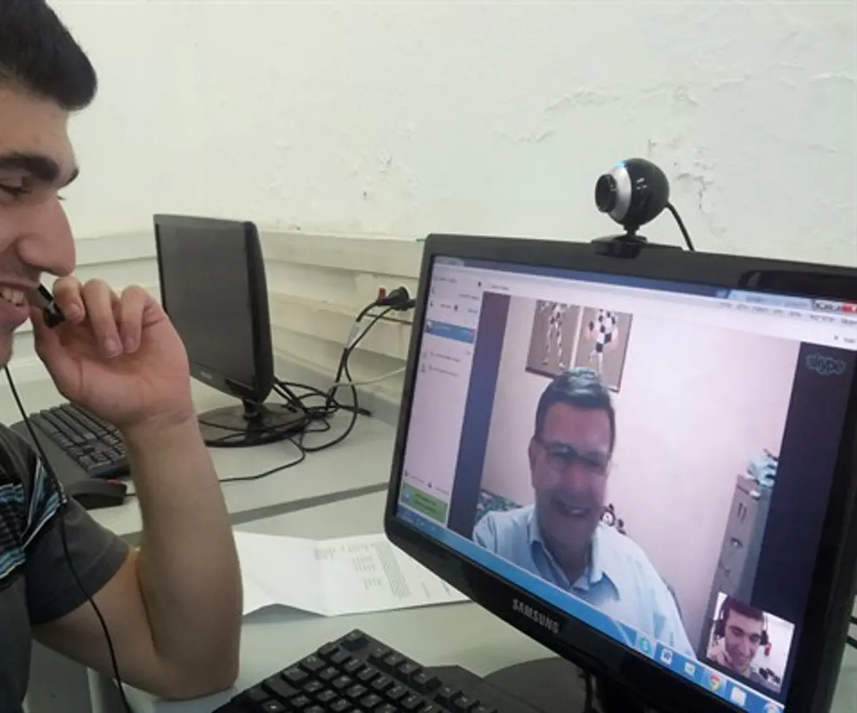 An Israeli high school student videoconferences with a North American baby boomer for a we