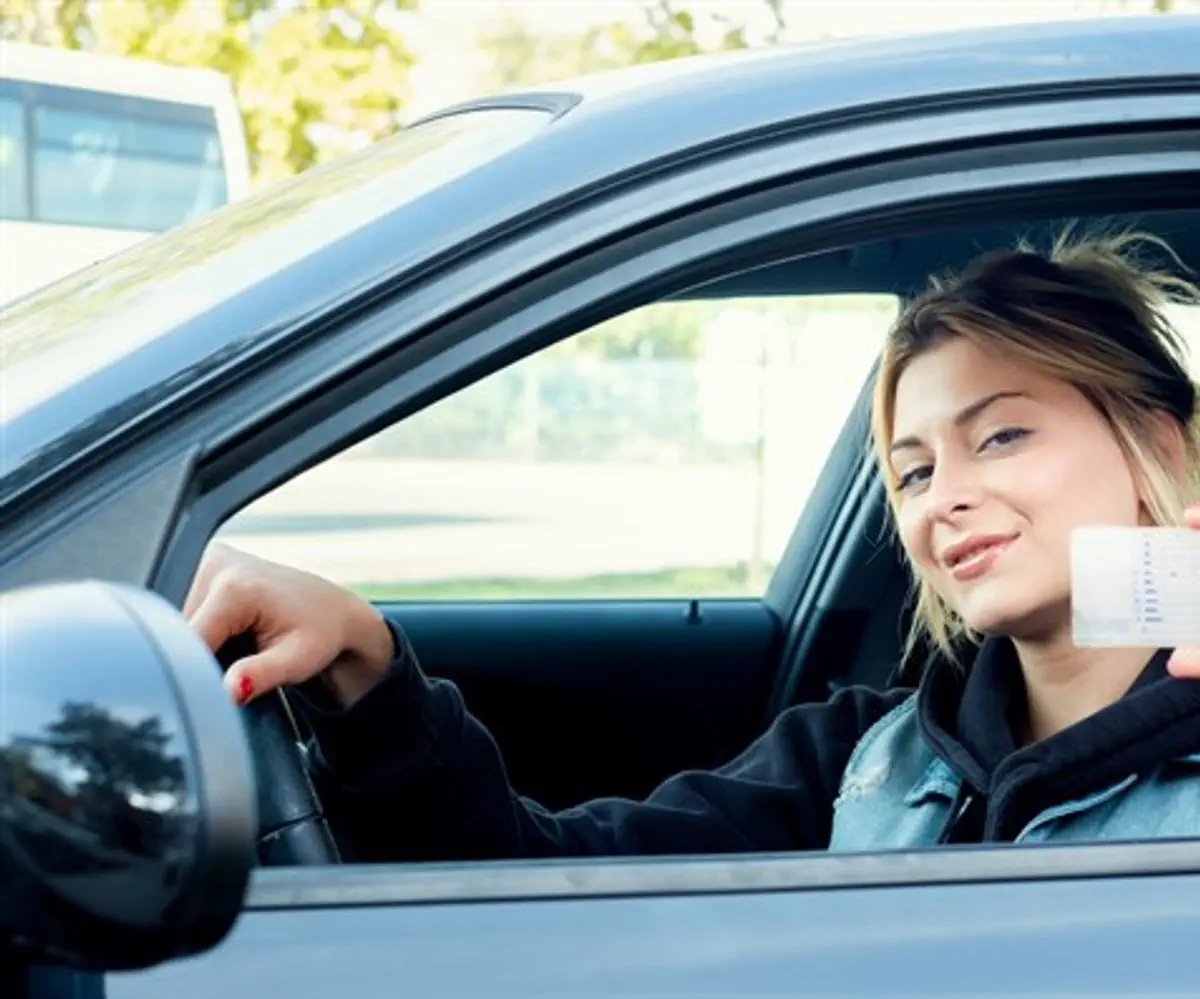 Woman showing drivers license