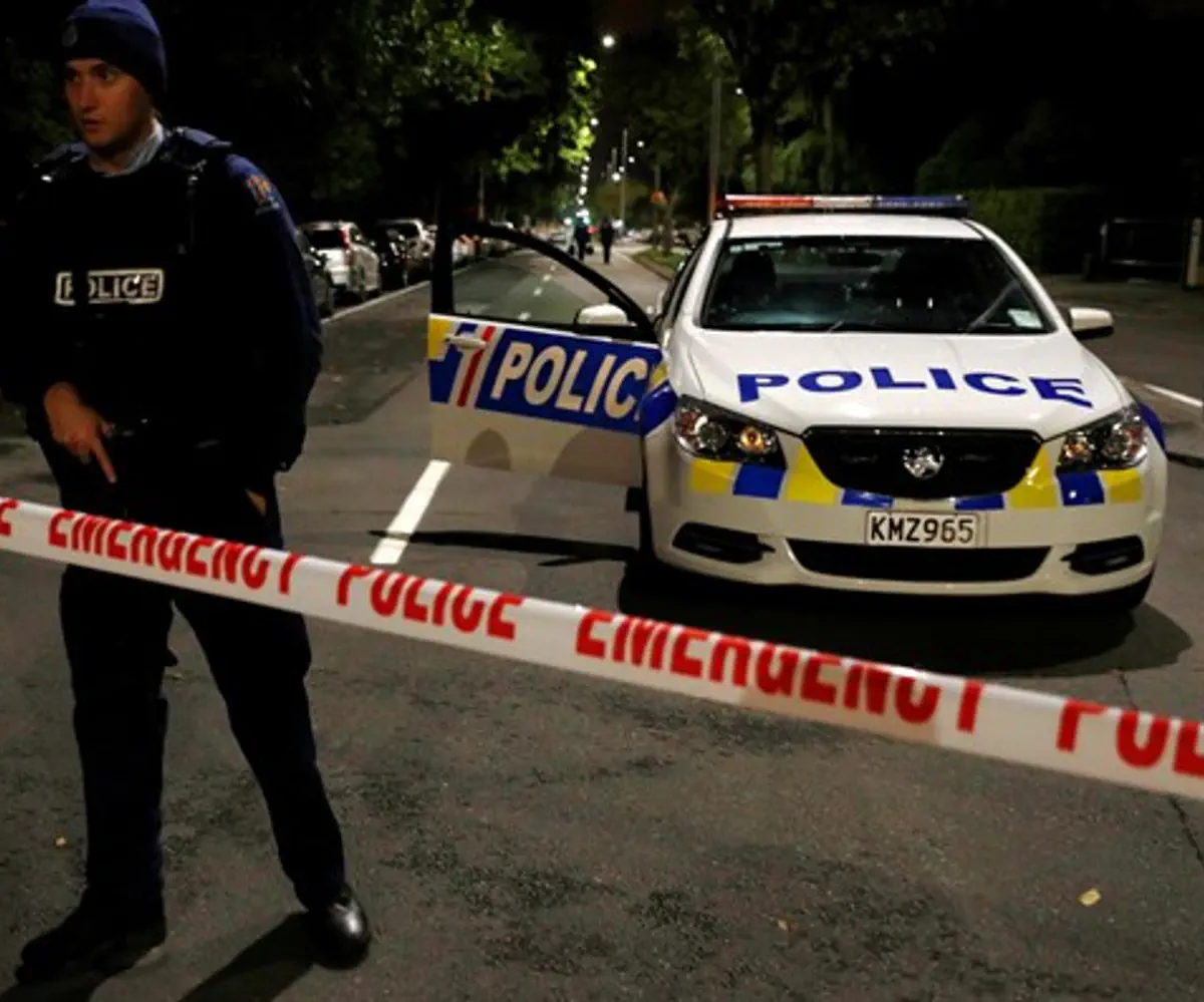 Armed police officers stand guard in outside mosque in Christchurch