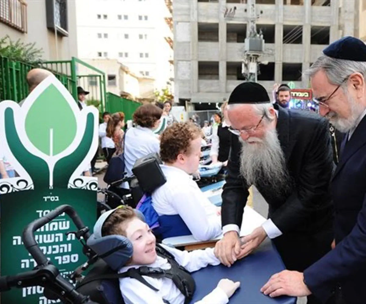 Rabbi Yehuda Marmostein and Rabbi Lord Jonathan Sacks greet ALEH residentss