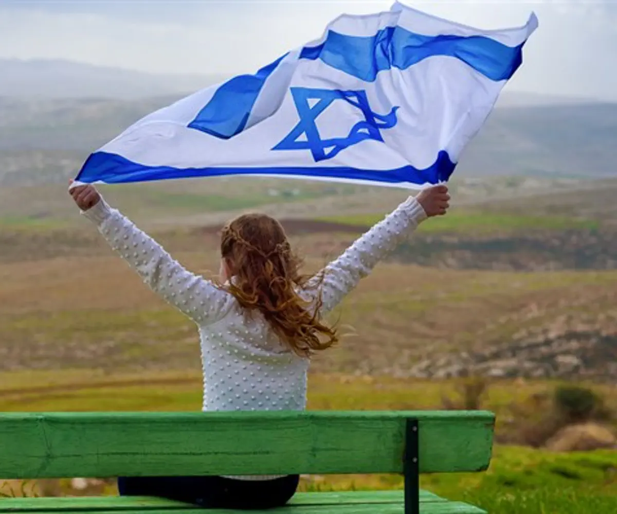 Girl holding Israeli flag