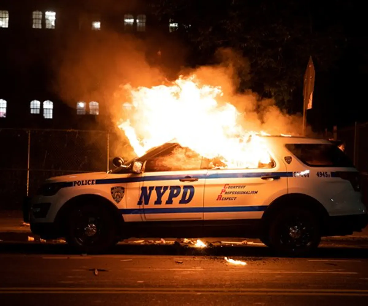 NYPD vehicle torched during riots in New York