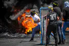 Terrorist killed, 88 rioters injured in clashes with IDF forces