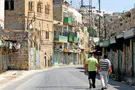 IDF soldier suspended for punching left-wing activist in Hebron