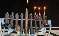 Hanukkah menorah from rocket fragments lit on Gaza-area yeshiva
