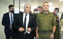 Lapid lights candles with IDF southern command